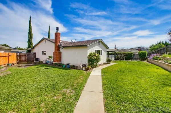 a view of a backyard with a garden