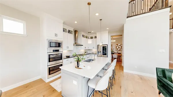 a bedroom with a bed and a potted plant