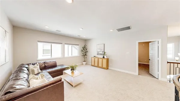 a bedroom with a bed and a wall painting