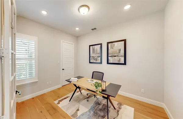 a living room with furniture a rug and a window