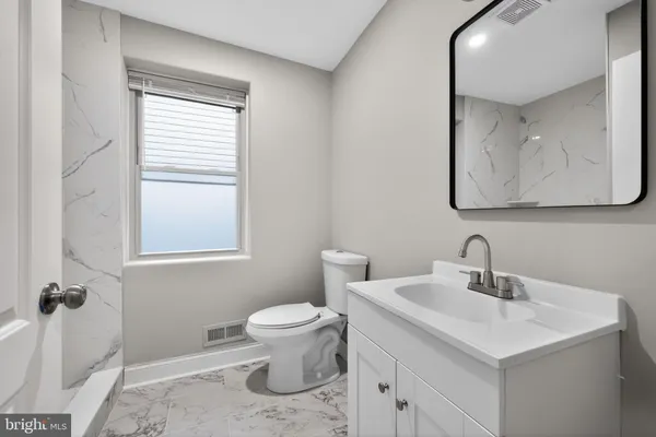 a bathroom with a sink and a toilet
