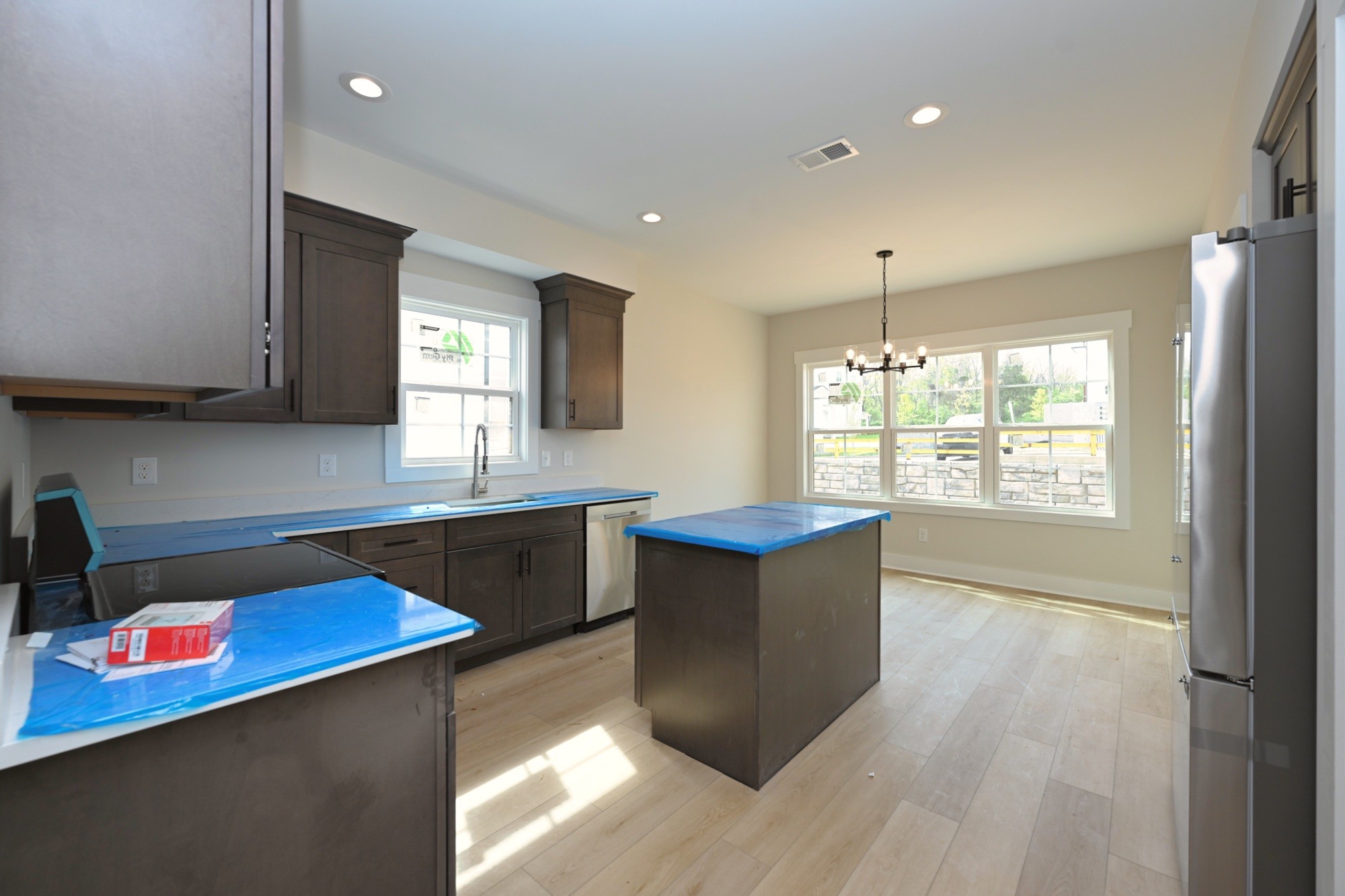 1204 Sylvia Drive Madison, TN 37115 - Photo 19 of 44 a kitchen with stainless steel appliances granite countertop a sink a stove and wooden floors
