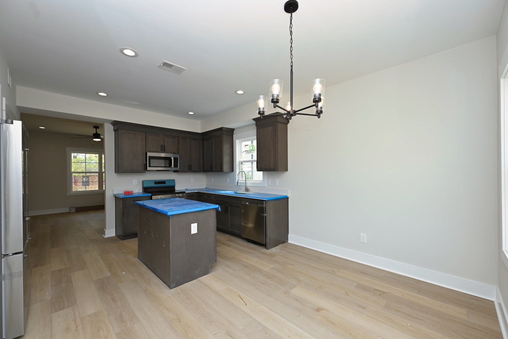 1204 Sylvia Drive Madison, TN 37115 - Photo 24 of 44 a kitchen with stainless steel appliances granite countertop a sink cabinets and wooden floor