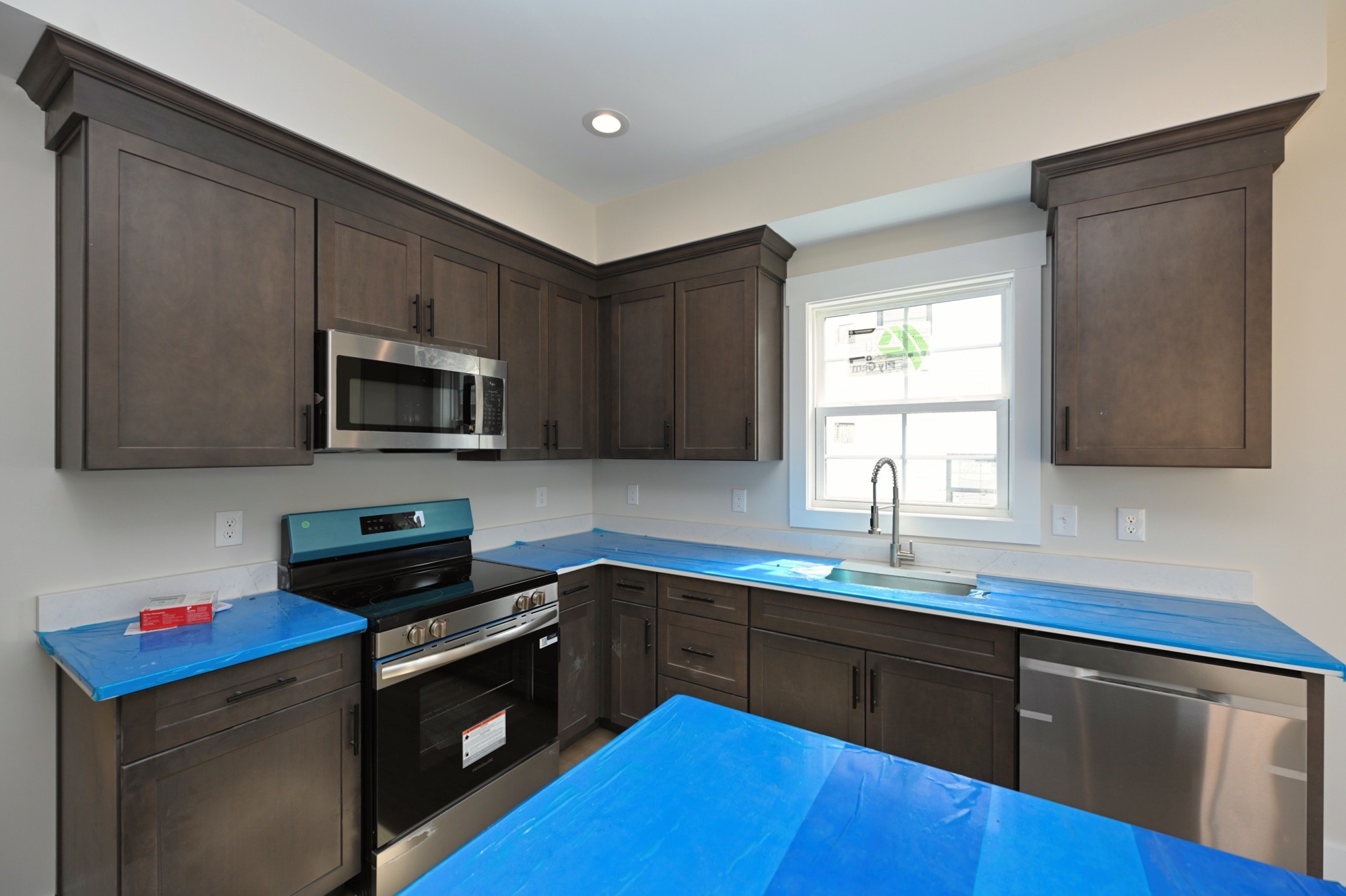 1204 Sylvia Drive Madison, TN 37115 - Photo 26 of 44 a kitchen with stainless steel appliances kitchen island granite countertop a sink dishwasher a stove and a refrigerator