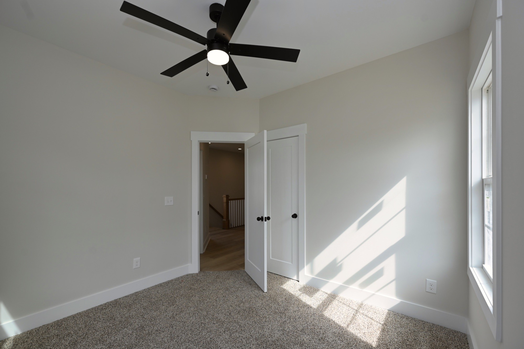 1204 Sylvia Drive Madison, TN 37115 - Photo 39 of 44 an empty room with chandelier fan and windows