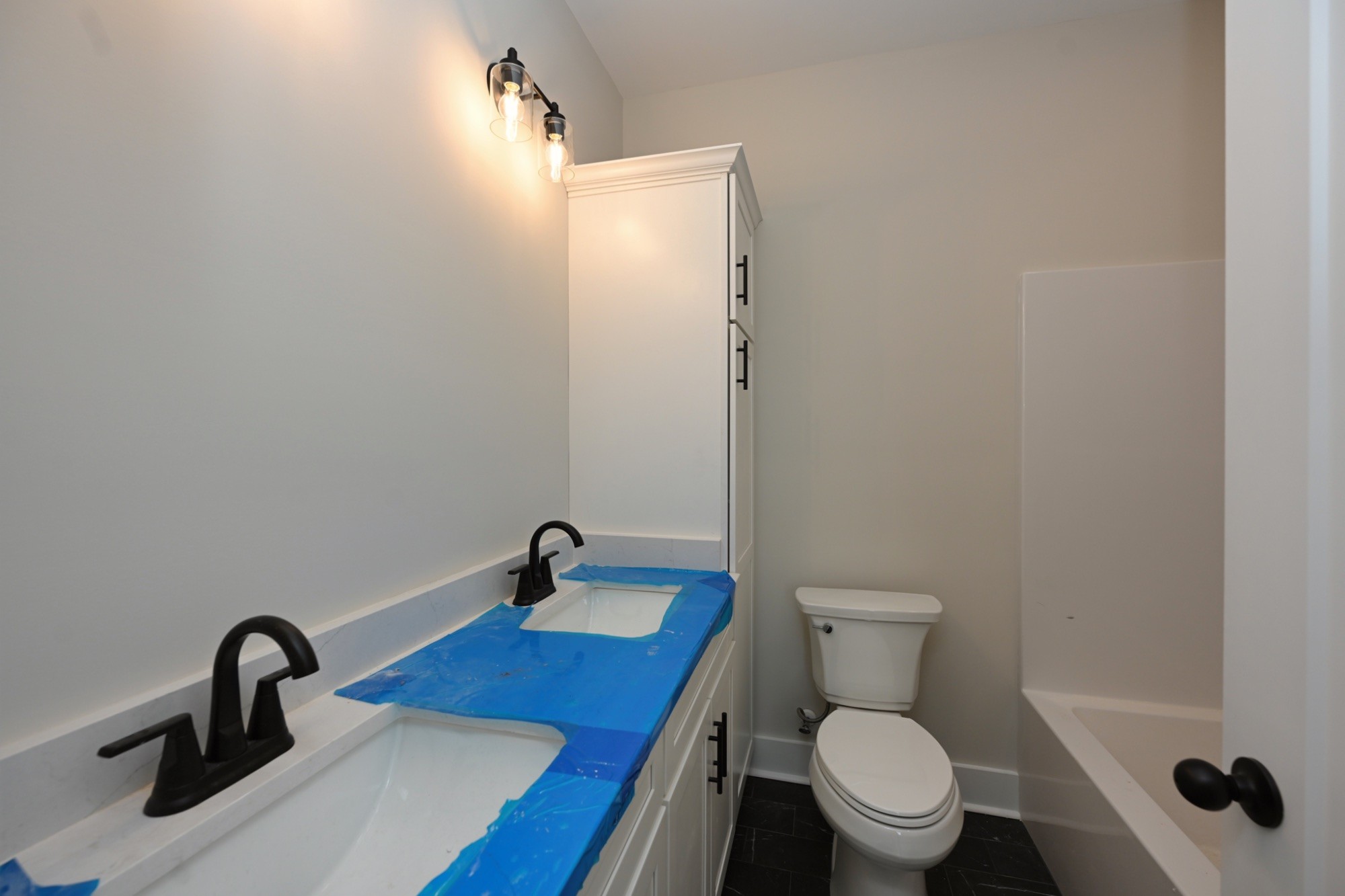 1204 Sylvia Drive Madison, TN 37115 - Photo 40 of 44 a bathroom with a sink a toilet and a mirror