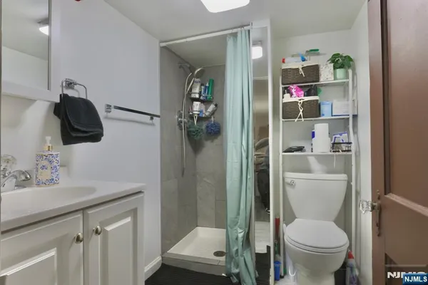 a bathroom with a toilet sink and shower