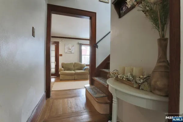 a view of living room with furniture and a potted plant