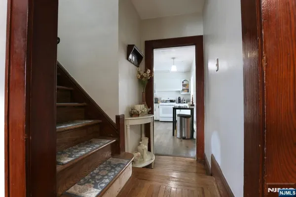 a view of hallway with wooden floor