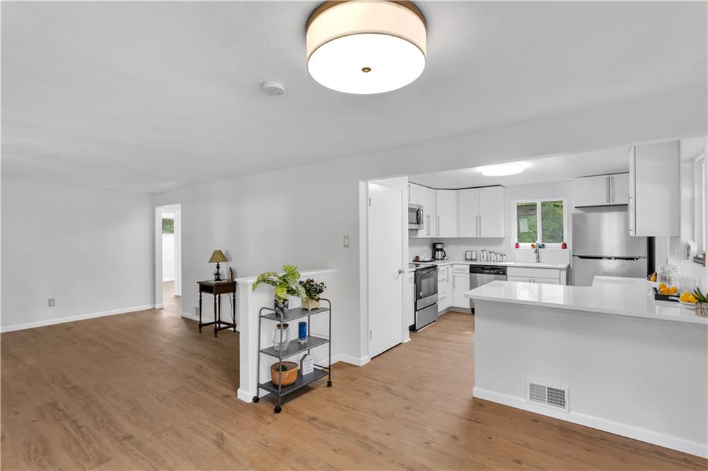 9830 Don Drive Irwin, PA 15642 - Photo 9 of 30 a view of a kitchen with dining table and chairs