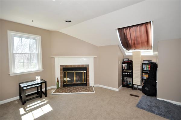 6 Apple Ridge Road, Unit 1 Maynard, MA 01754 - Photo 8 of 14 a living room with furniture a window and a fireplace