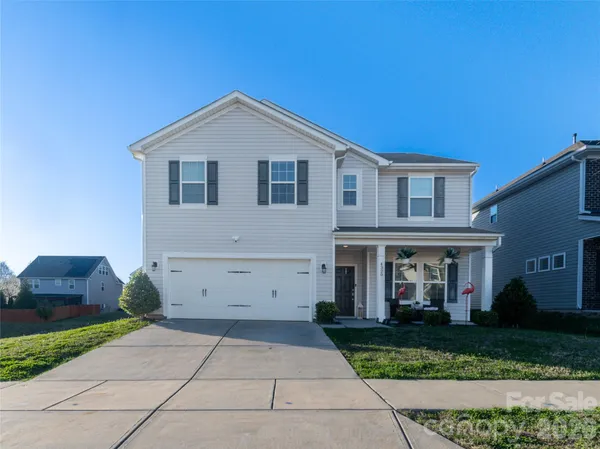 a view of house and outdoor space with yard