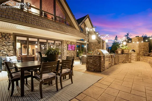 a view of a dinning tables and chairs in a patio