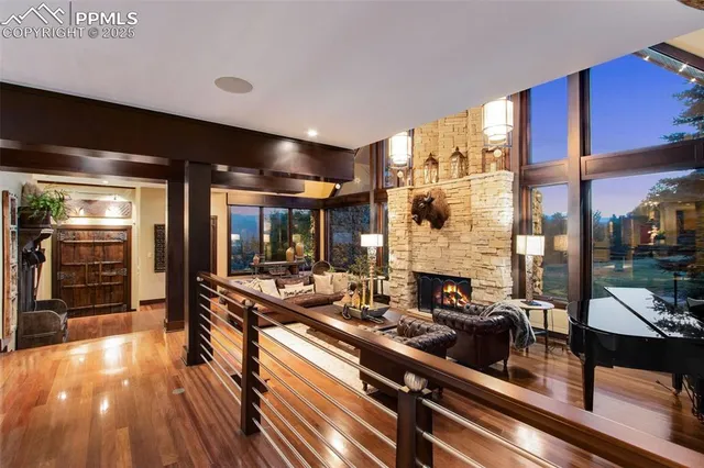 a view of a living room with furniture and wooden floor