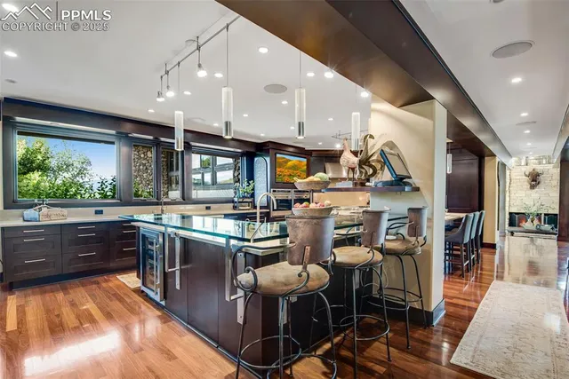 a kitchen with stainless steel appliances kitchen island granite countertop lots of counter top space and furniture