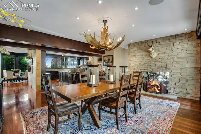 a dining room with furniture and wooden floor