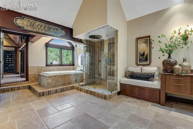 a large spacious bathroom with a double vanity sink a mirror and a bathtub