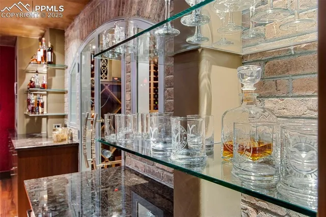 a bedroom with large bed and a large window