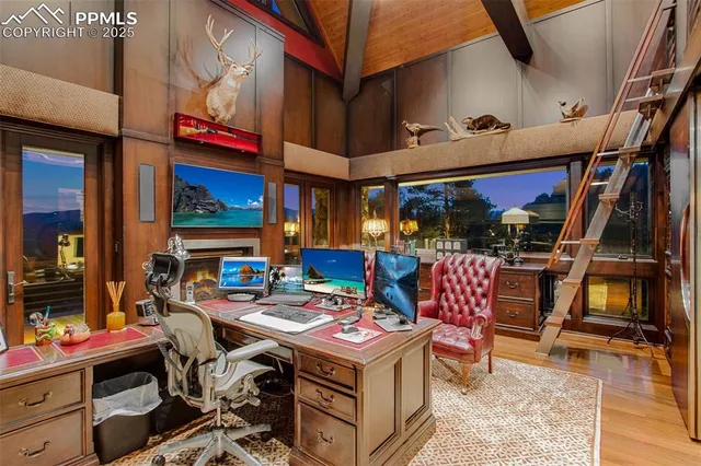 a living room with furniture a rug and a table