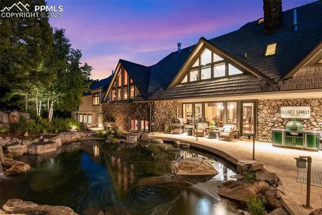 a view of a patio with table and chairs with wooden floor and fence