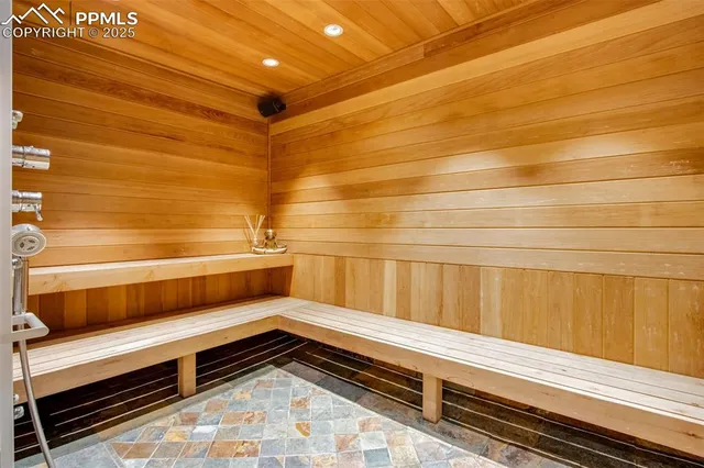 a street view that has wooden fence and a bench