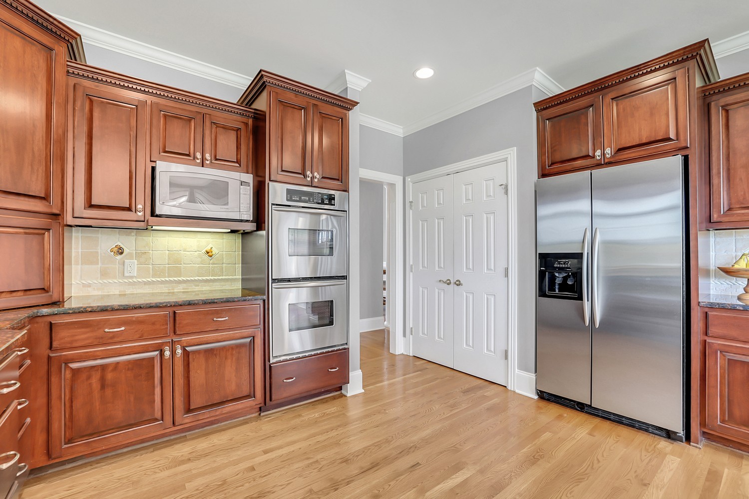 423 Ridgecrest Lane Lebanon, TN 37087 - Photo 11 of 65 a kitchen with stainless steel appliances granite countertop a refrigerator and a stove top oven