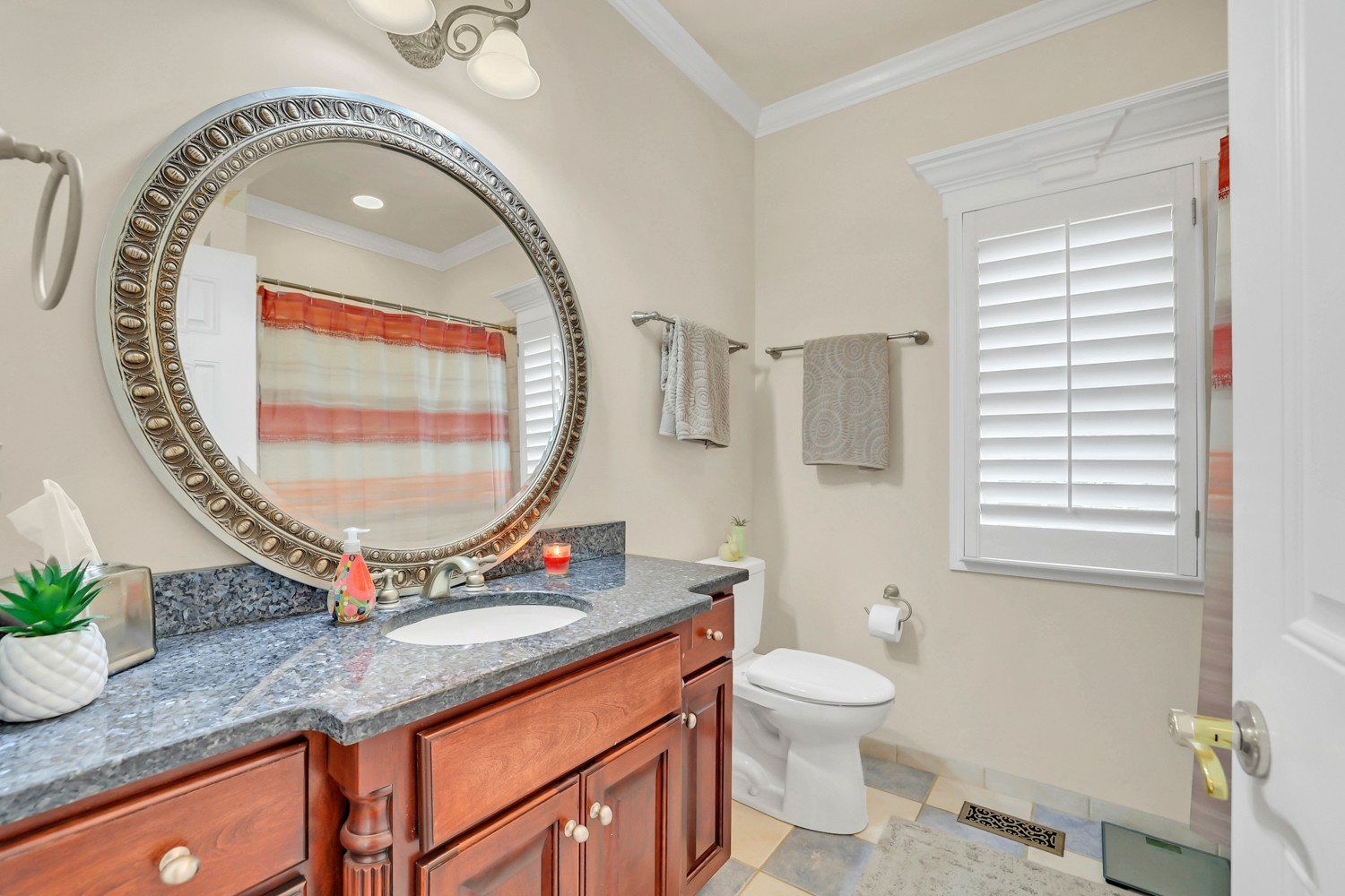423 Ridgecrest Lane Lebanon, TN 37087 - Photo 31 of 65 a bathroom with a granite countertop sink a mirror and a toilet