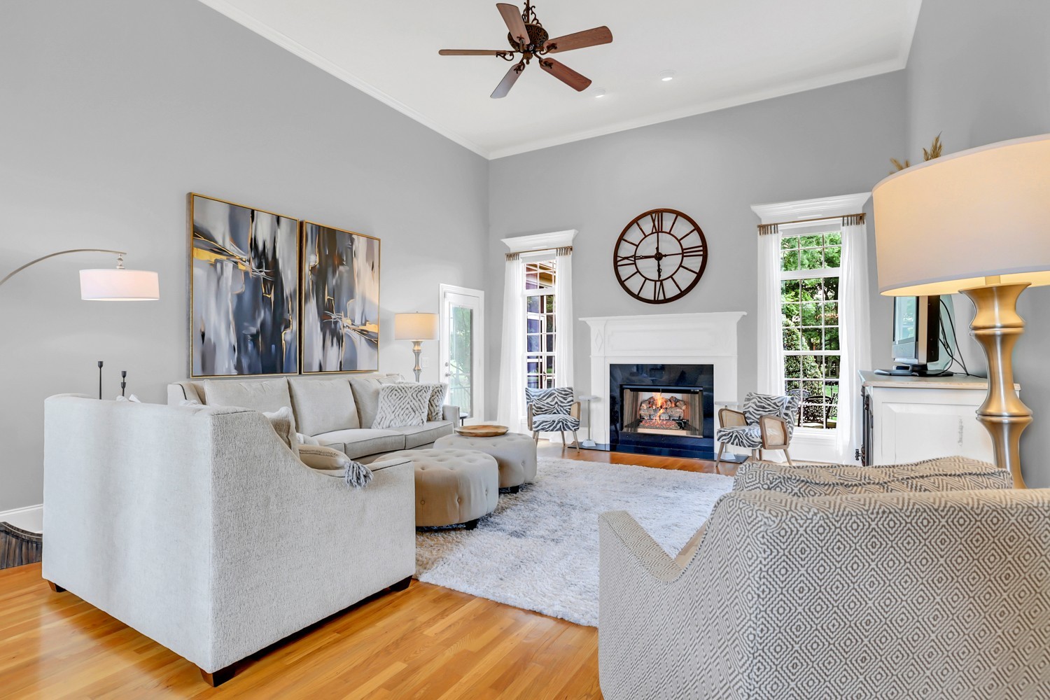 423 Ridgecrest Lane Lebanon, TN 37087 - Photo 5 of 65 a living room with furniture a clock and a fireplace