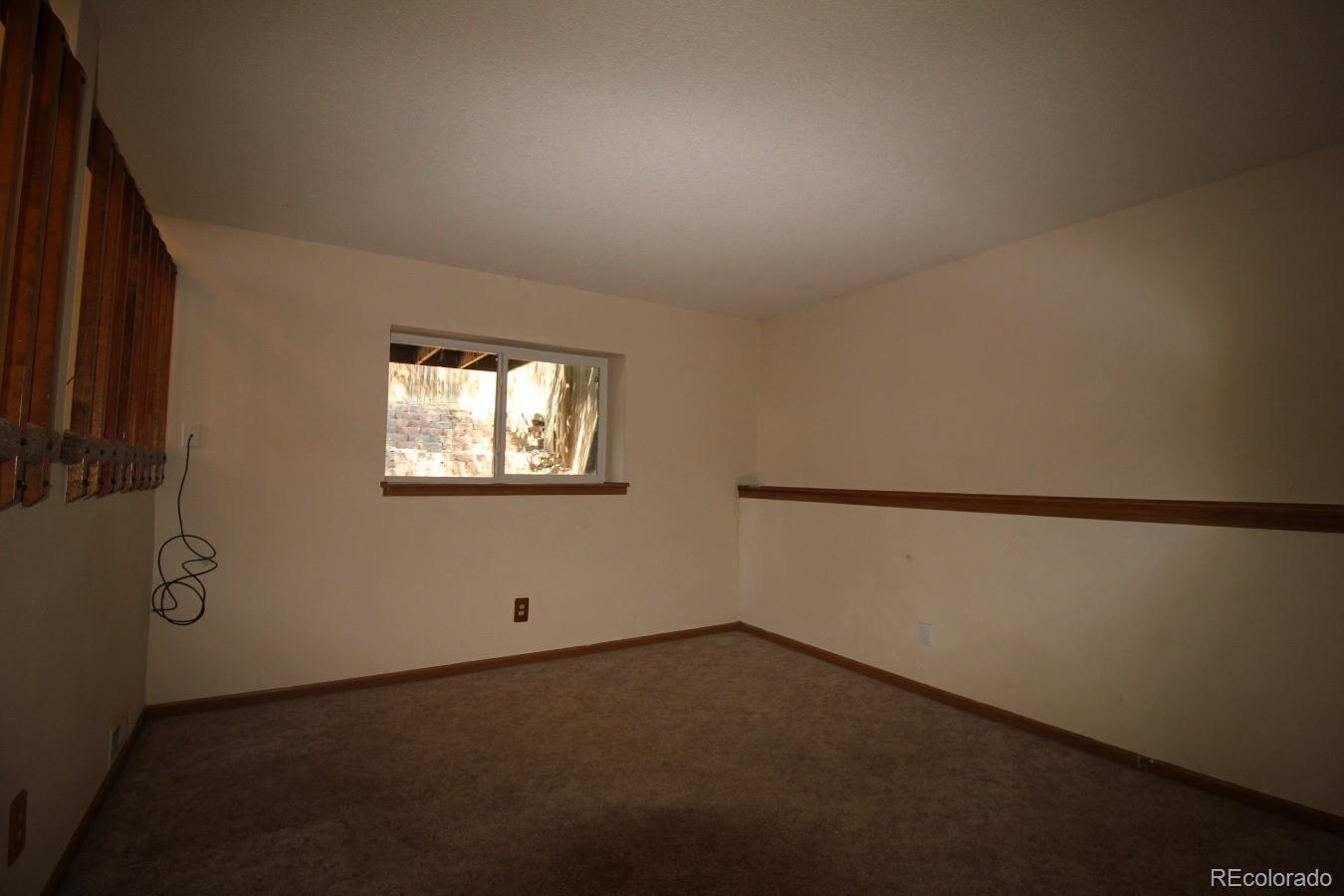 587 Longfellow Lane Highlands Ranch, CO 80126 - Photo 9 of 13 a view of an empty room with a window