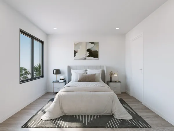 a bedroom with a bed and window