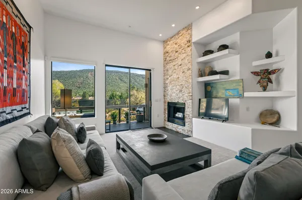 a living room with furniture and a large window