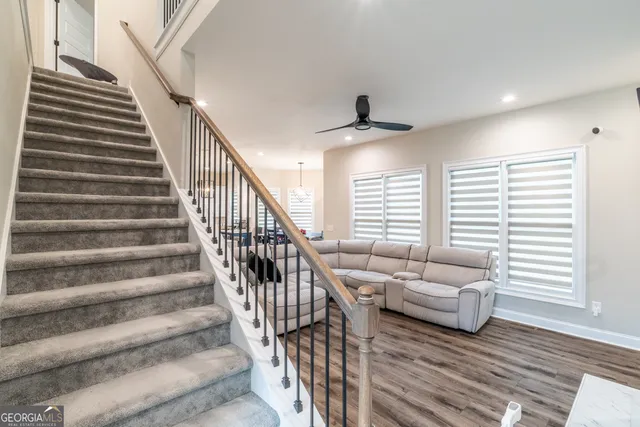 a large kitchen with a table and chairs