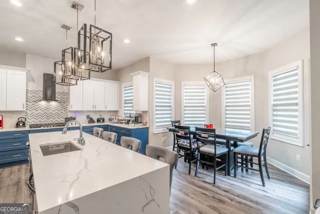 a view of a livingroom with workspace and a couch
