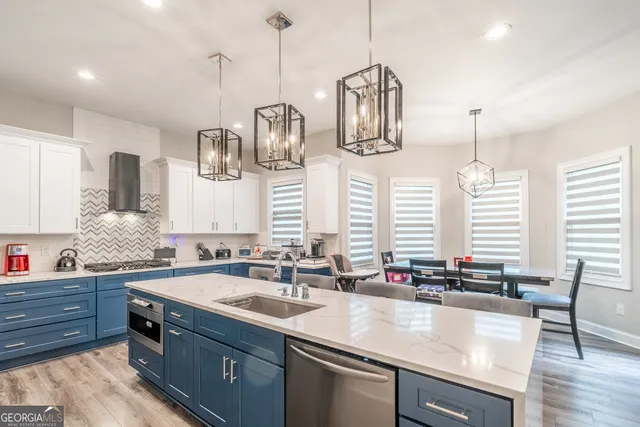 a kitchen with sink and cabinets