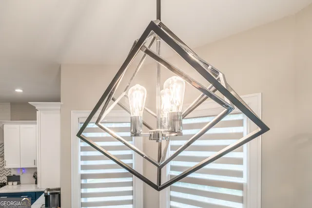 a living room with furniture a ceiling fan and a window