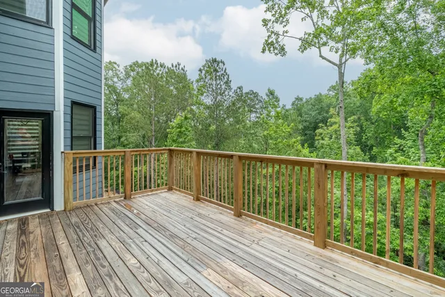 a view of walk in closet with clothes