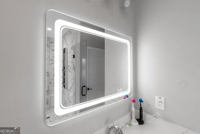 a en suite bathroom with a sink and mirror