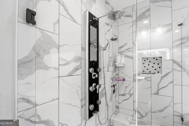 a bathroom with double sink and a mirror