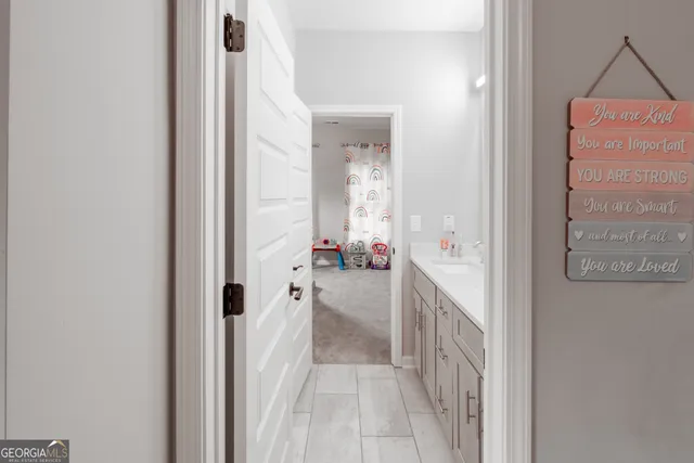 a view of a door and wooden floor