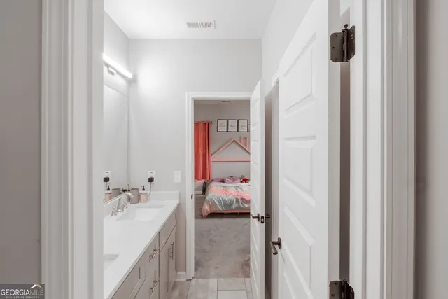 an aerial view of a house with outdoor space and a lake view