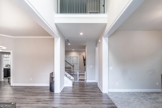 a view of livingroom with hardwood floor and hallway