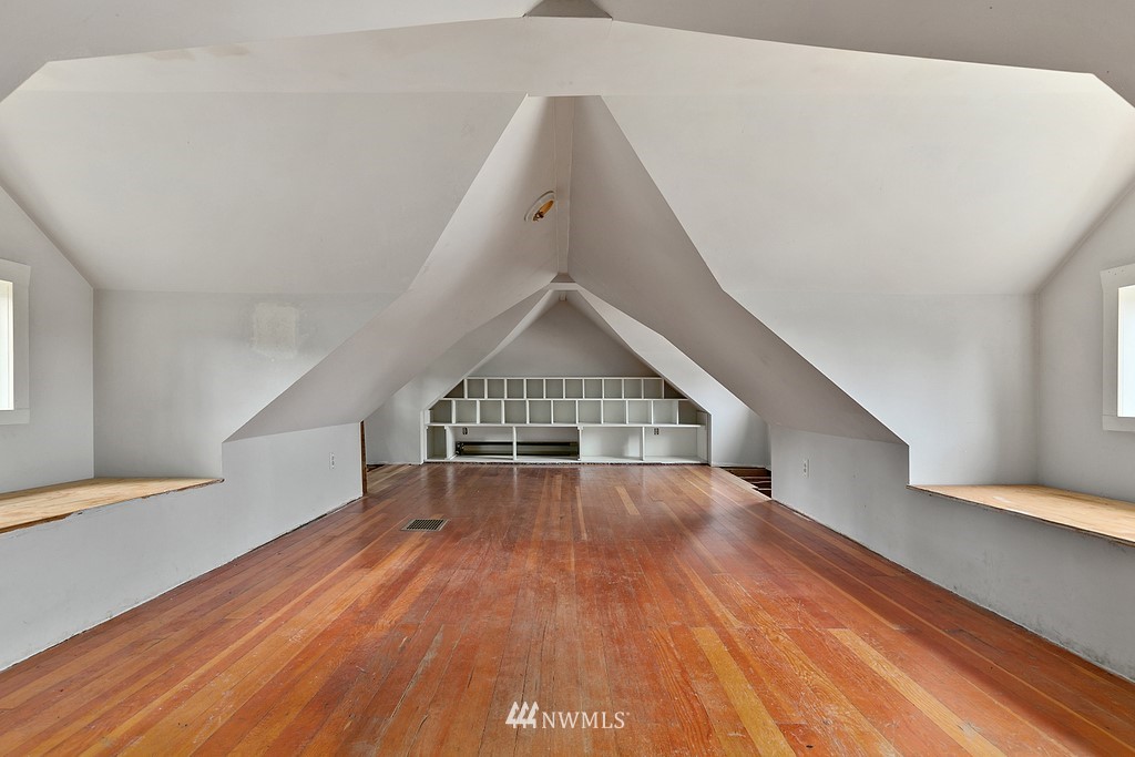 2620 Callow Road Lake Stevens, WA 98258 - Photo 17 of 25 a view of an empty room with wooden floor and stairs