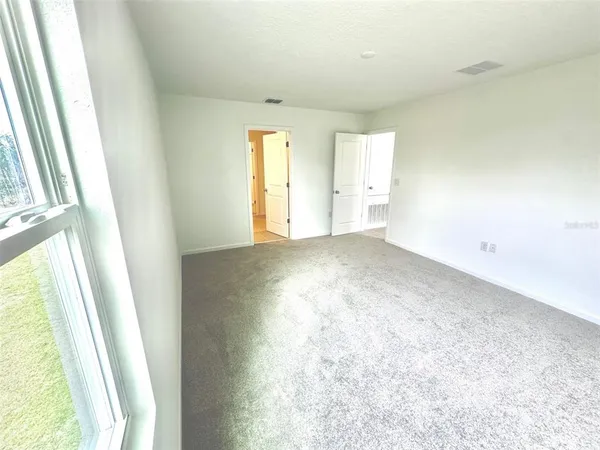 a view of an empty room and window