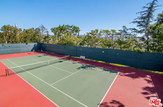 a bathroom with a sink toilet and mirror