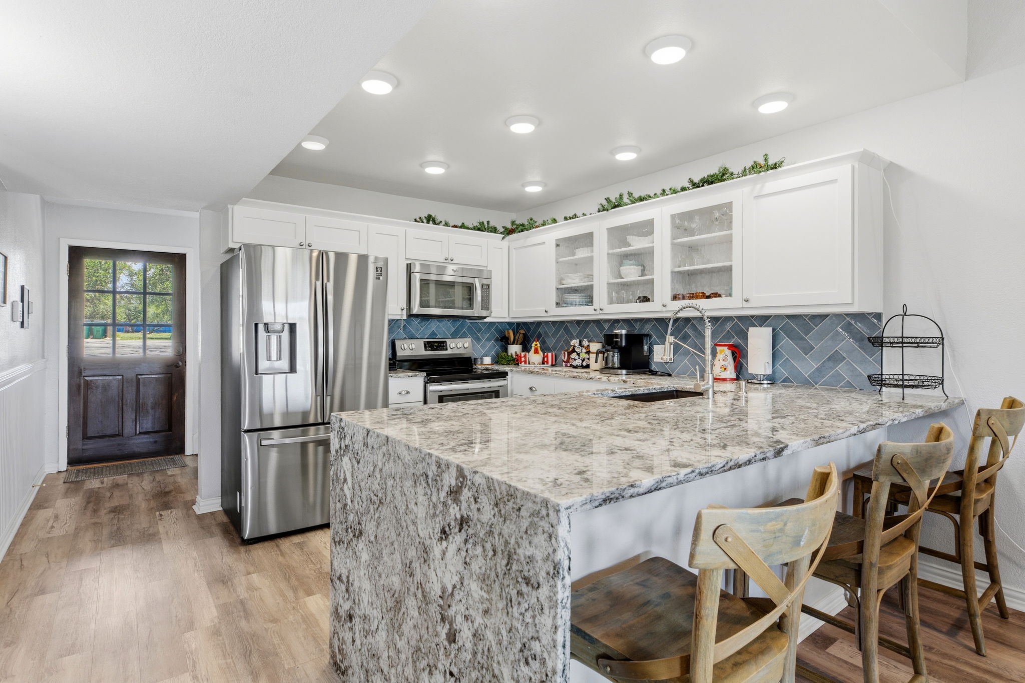 319 Venture Boulevard South Point Venture, TX 78645 - Photo 6 of 25 Beautiful kitchen updated 1 year ago.