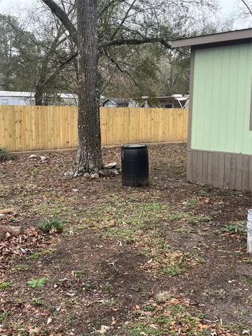 a view of a house with a door and a bench