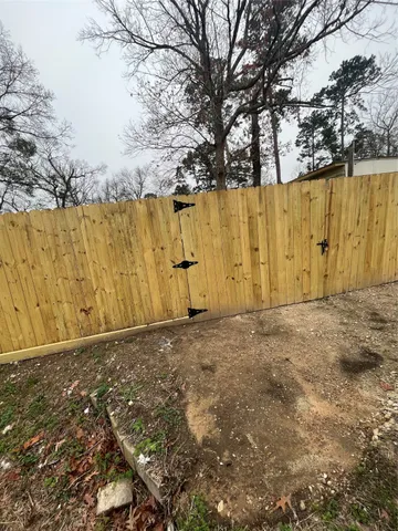 a view of a field with a tree