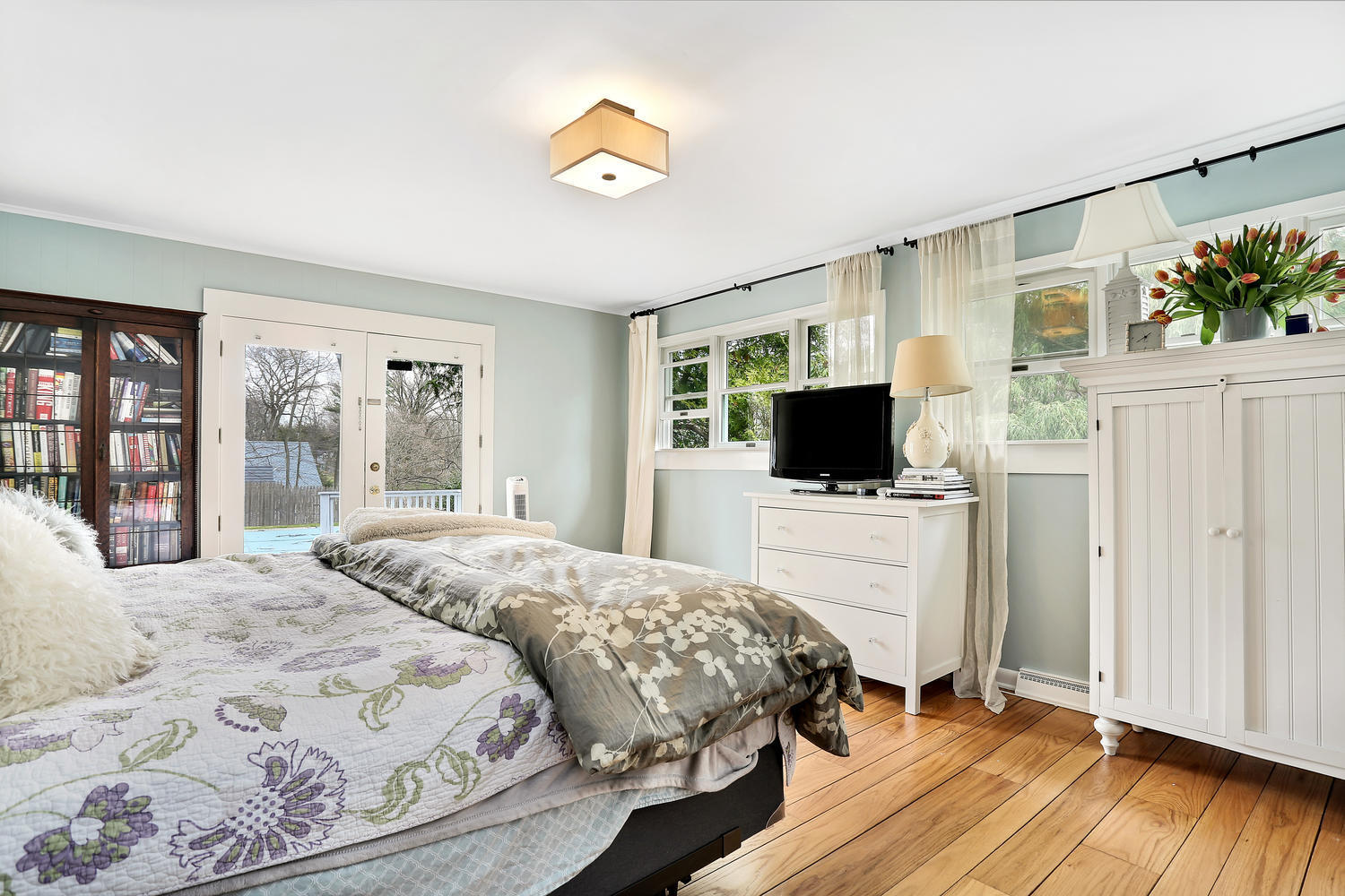 13 Fairmead Road Darien, CT 06820 - Photo 10 of 23 a bedroom with a bed and a flat screen tv