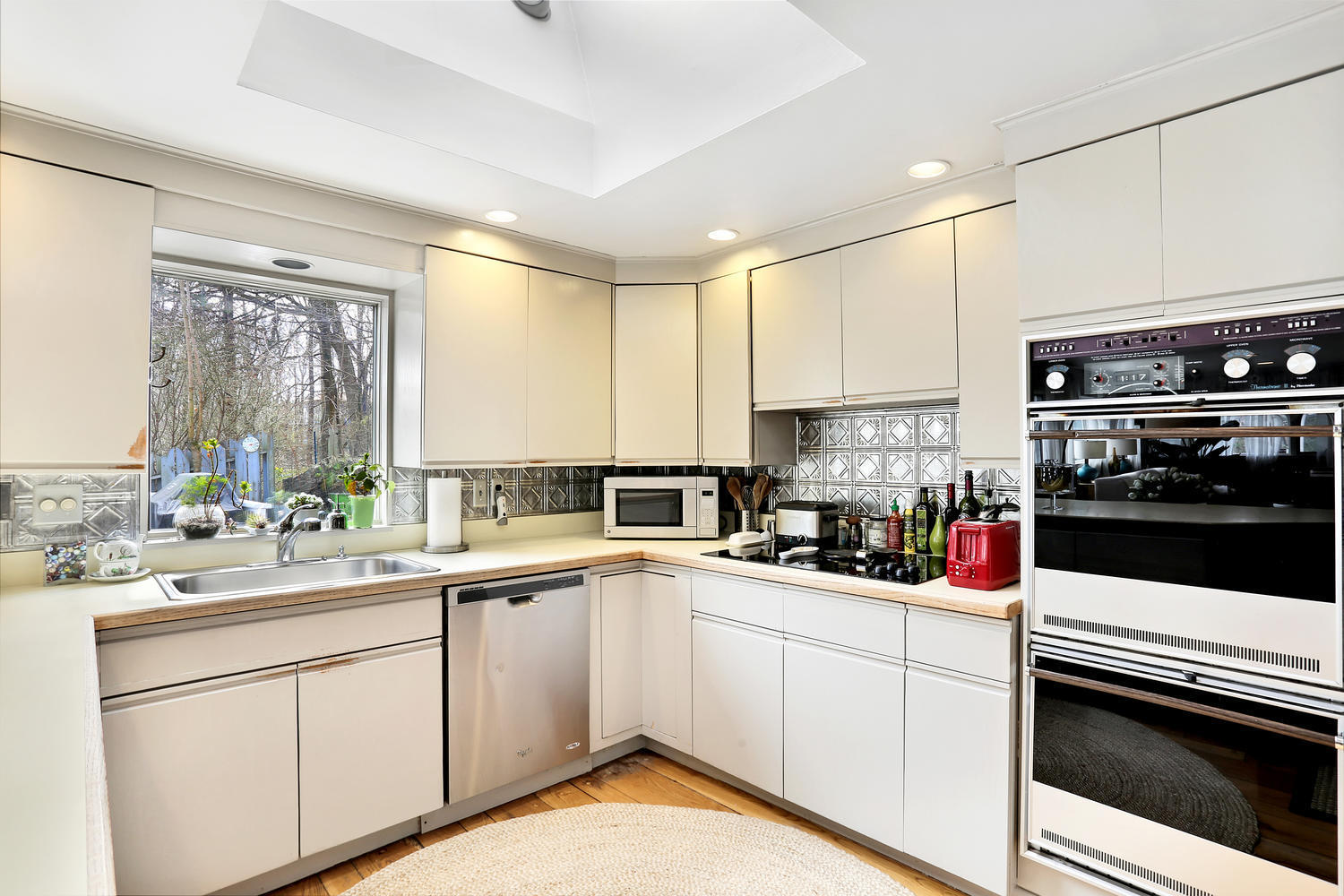 13 Fairmead Road Darien, CT 06820 - Photo 7 of 23 a kitchen with a sink stove and cabinets