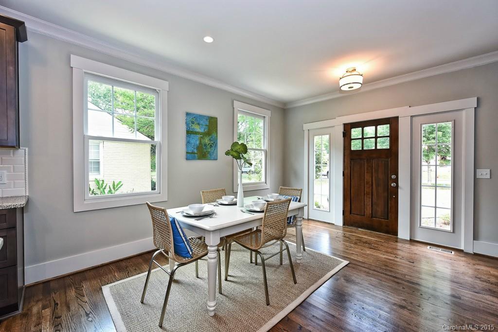 913 Sedgefield Road Charlotte, NC 28209 - Photo 2 of 24 a view of a dining room with furniture wooden floor and a window